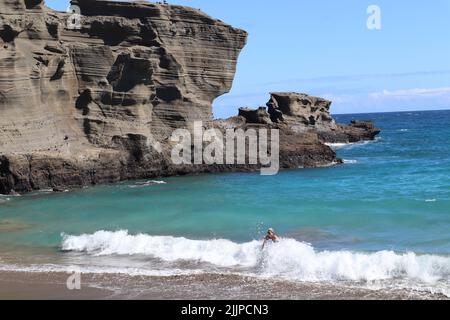 A natural view of Papakolea Green Sand Beach on the Hawaiian Island of Kona, Hawaii Stock Photo