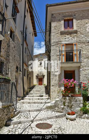 A vertical view of the narrow street among old stone houses of Civitella Alfedena, Abruzzo, Italy Stock Photo