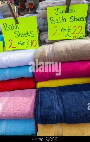 England, Dorset, Christchurch, Christchurch Market, Clothing Stall display of Bath Sheets Stock Photo