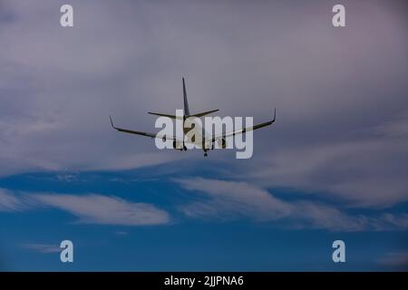 A Commercial Airliners aircraft airplane approaching landing at YVR airport in Richmond BC Canada Stock Photo