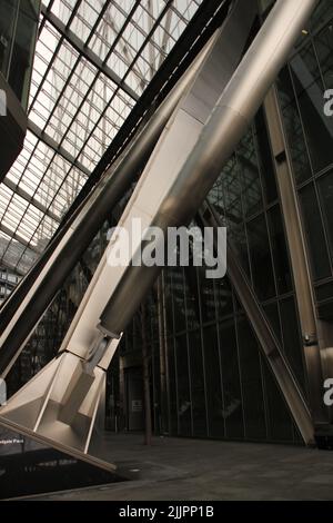 A vertical shot of a modern glass architectural building with ...
