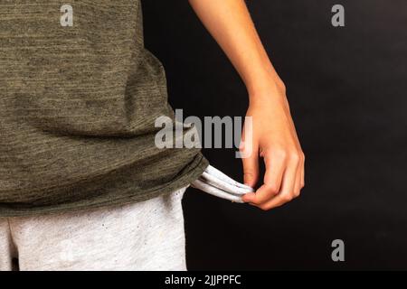A guy showing his empty pockets Stock Photo