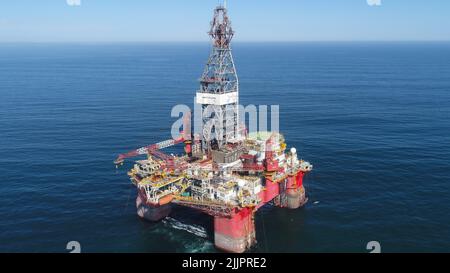 An aerial drone shot of an oil rig near Walvis Bay in Namibia Stock Photo