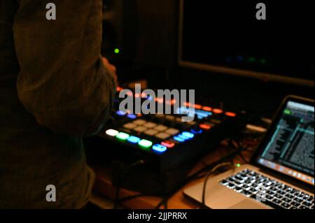 A shot of sound engineer with his devices and equipment in the studio Stock Photo