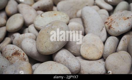 A macro view of small grey rocks with texture and patterns Stock Photo