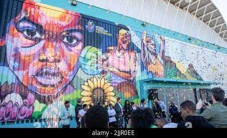 Cape Town, South Africa. 27th July, 2022. Participants unveil a mural for the 2023 Netball World Cup at the Langa sports center in Cape Town, South Africa, July 27, 2022. Cape Town on Wednesday marked one year to host the 2023 Netball World Cup, unveiling the first of a series of murals for the competition. Credit: Lyu Tianran/Xinhua/Alamy Live News Stock Photo