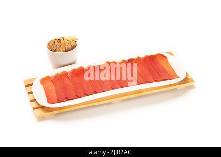 A closeup shot of tuna fillet with crackers on white background Stock Photo