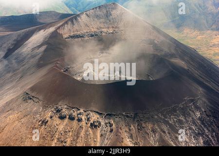 Stunning bird's eye view closeup photography of a smoking volcano caldera in the Serengeti, Tanzania. Stock Photo