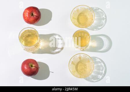 Apple cider vinegar and apples arranged on a table Stock Photo