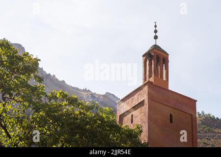 A beautiful shot of the sun hitting to a tall building in a small village Stock Photo