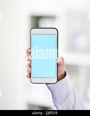 Business phone with blank screen or copy space for a website, marketing or advertising app. Closeup of man holding or showing copyspace on wireless Stock Photo