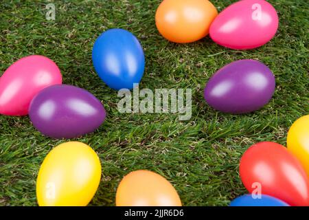 The artificial colored eggs on the grass - Easter concept Stock Photo
