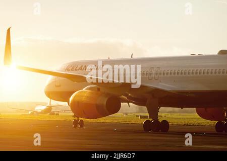 A shot of an Icelandair Boeing 757 airliner at the Dublin Airport with direct sunlight