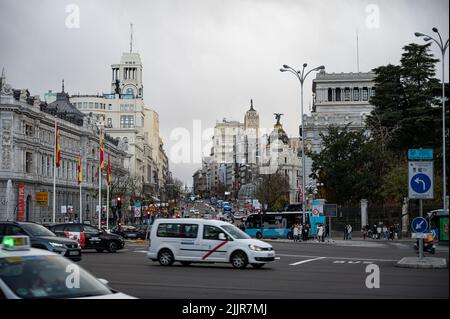 A view of Gran Via street with traffic and beautiful buildings in Madrid, Spain Stock Photo
