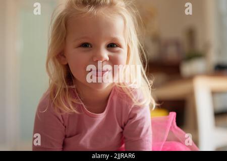 I take the cutest child award. an adorable little girl sticking her tongue out. Stock Photo