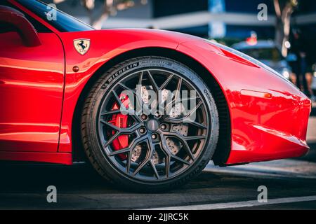 A close-up of a red Ferrari car rim wheel, side view Stock Photo