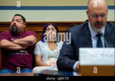 Jazmin Cazares, center, whose nine year-old sister Jacklyn Cazares, was one of the children killed by a gunman at Robb Elementary School in Uvalde, Texas, is seated next to her father Javier Cazares, left, during a House Committee on Oversight and Reform hearing “Examining the Practices and Profits of Gun Manufacturers” in the Rayburn House Office Building in Washington, DC, USA, July 27, 2022. Photo by Rod Lamkey/CNP/ABACAPRESS.COM Stock Photo