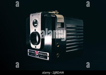An old vintage camera on a dark background Stock Photo