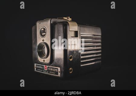 An old vintage camera on a dark background Stock Photo