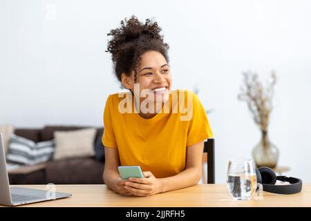 Portrait of successful young woman freelance in casual clothes working at home office or coworking Stock Photo