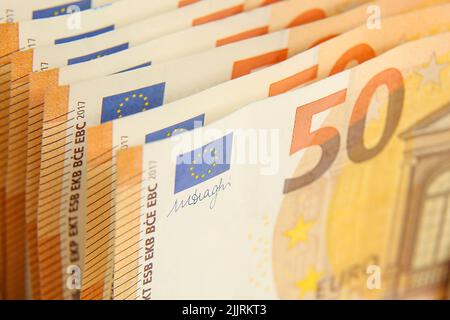 Banknotes of the 50 euro banknote close-up. Paper cash euros. Stock Photo