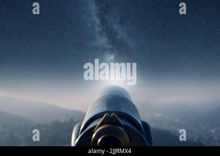 Look at the starry sky with a telescope Stock Photo