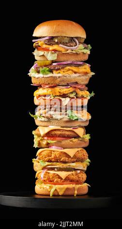 Piled Hamburger Tower on black background Stock Photo