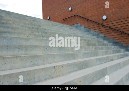 Concrete stairs by modern brick building Stock Photo