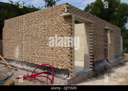 Small brick house under construction Stock Photo