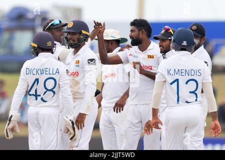 Galle, Sri Lanka. 28th July 2022. Sri Lanka's Prabath Jayasuriya (4R) celebrates with teammates after taking the wicket of Pakistan's captain Babar Azam during the 5th day of the 2nd test cricket match between Sri Lanka vs Pakistan at the Galle International Cricket Stadium in Galle on 28th July, 2022. Viraj Kothalwala/Alamy Live News Stock Photo