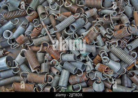 A heap of various old hand tools, springs, and screws in a junk shop in Zrenjanin, Serbia Stock Photo