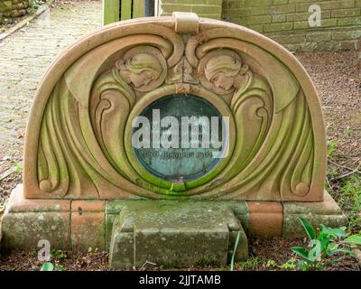 Carved terracotta headstone in the Watts Chapel cemetery, Compton, Guildford, Surrey, UK Stock Photo