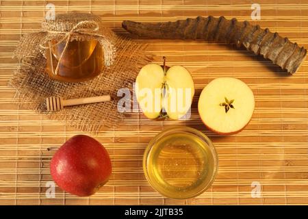 Rosh HaShanah holiday. Celebrating attributes - apples, honey, shofar Stock Photo