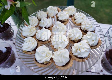 A closeup shot of delicious cupcakes on the wedding table Stock Photo