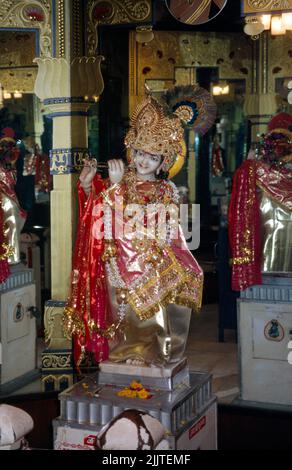 Amitsar India Shri Durgiana Temple Statue of Lord Krishna playing Flute Stock Photo