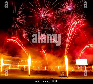 The display of colorful fireworks against the dark sky background in Sydney Olympic Park Stock Photo