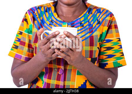 portrait of hands the mature woman standing and holding a cup of coffe. Stock Photo