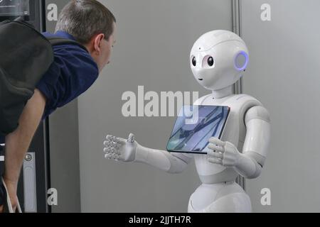 A social humanoid  robot optimized for human interaction through conversation and his touch screen Stock Photo