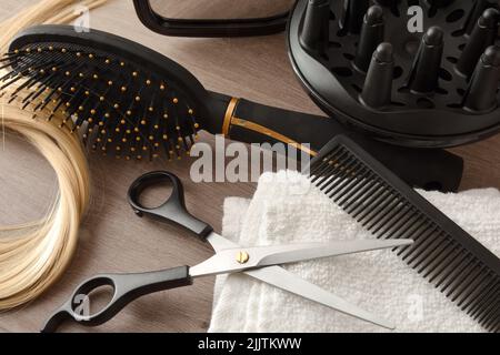 Detail of hairdressing tools on wooden table. Elevated view. Horizontal composition. Stock Photo
