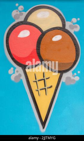 An ice cream cone graffiti art on blue wall in Auerbach, Saxony Stock Photo