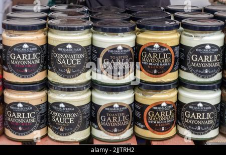 Jars of garlic products from the Garlic Farm on the Isle of Wight on a stall at the New Forest and Hampshire County Show in July 2022, England, UK Stock Photo