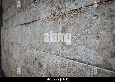 A closeup of an old rough textured wall outdoors - perfect for wallpapers and backgrounds Stock Photo
