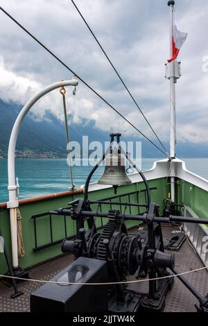 A vertical shot of the anchor windlass with the bell on the ship. Interlaken, Switzerland. Stock Photo