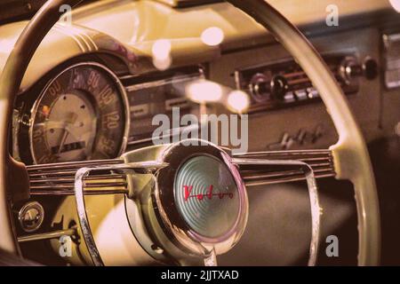 Volvo classic car interior - vintage dashboard showing the original Volvo cars logo and the Swedish desgin concept of the era Stock Photo