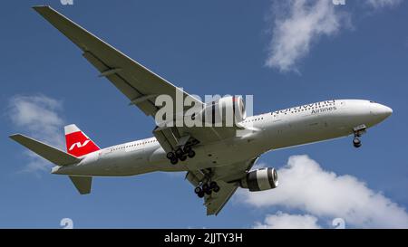 A low angle shot of a Nordwind Airlines Boeing 777 airplane flying from Varadero Airport international Stock Photo