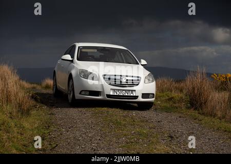 A closeup shot of a White 2012 Vauxhall Insignia In the Highlands of Cavan Count Stock Photo