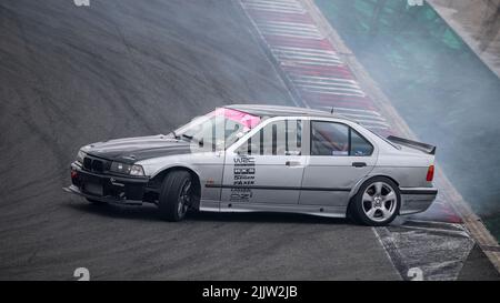 Gray Bmw E36 drift at the Navarra circuit Stock Photo - Alamy