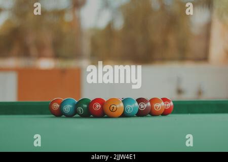 balls lined up on the pool table Stock Photo
