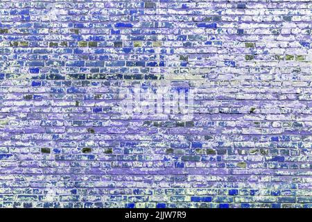 Old red brick wall. Peeling white paint on a red wall. Stock Photo