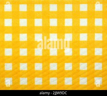 Clean sponge cloths with a checkered pattern as a background. Household cleaning cloth. Closeup of cleaning rag background. Stock Photo